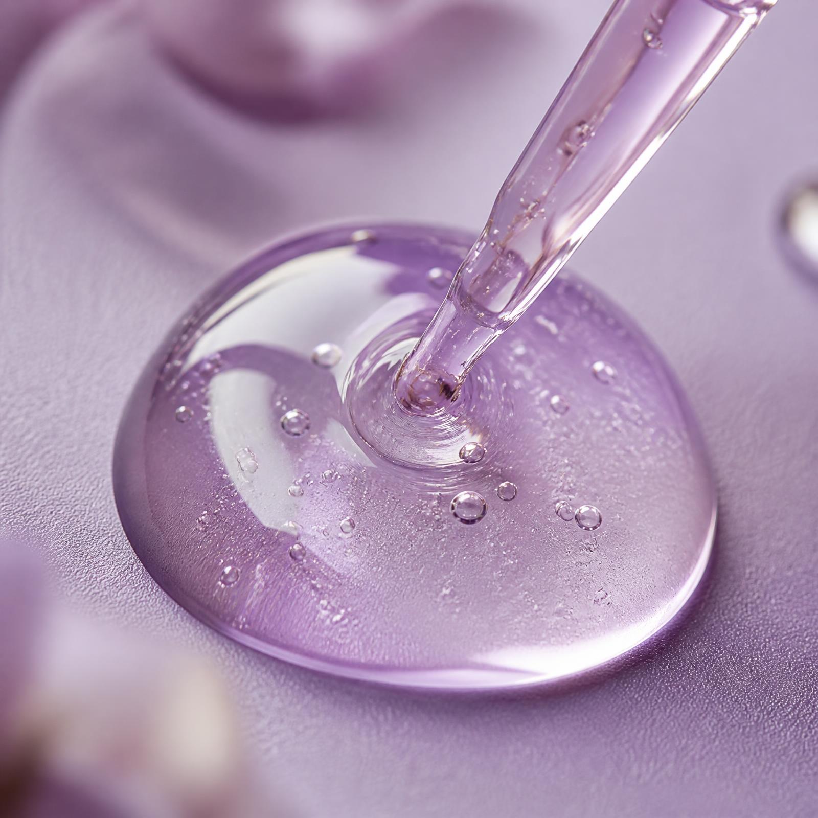 Close-up of a biotechnology-derived material droplet on a lavender laboratory surface